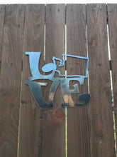 Load image into Gallery viewer, a pair of scissors sitting on a table