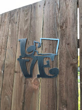 Load image into Gallery viewer, a blue and white sign on a wooden pole