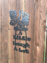 Load image into Gallery viewer, a close up of a baseball bat on a wooden fence