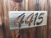 Load image into Gallery viewer, a sign that is on the side of a building