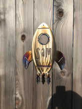Load image into Gallery viewer, a clock that is on the side of a wall