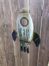 Load image into Gallery viewer, a close up of a fire hydrant next to a fence