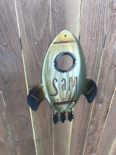 Load image into Gallery viewer, a close up of a parking meter in a field