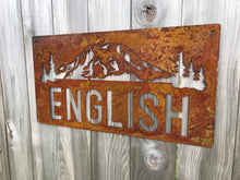 Load image into Gallery viewer, a sign that is on the side of a building