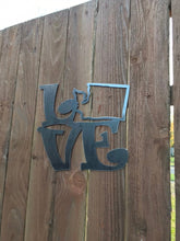 Load image into Gallery viewer, a sign that is on the side of a building