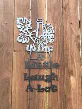 Load image into Gallery viewer, a wooden wall with a clock on it