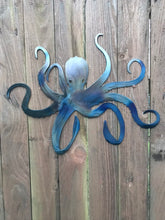 Load image into Gallery viewer, a pair of scissors sitting on top of a table
