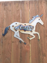 Load image into Gallery viewer, a statue of a horse on a wooden bench