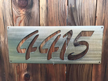 Load image into Gallery viewer, a group of surfboards sitting on top of a wooden shelf