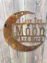 Load image into Gallery viewer, a wooden clock on the side of a building
