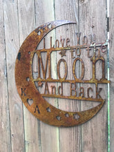 Load image into Gallery viewer, a wooden clock on the side of a wooden fence
