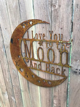 Load image into Gallery viewer, a wooden clock on the side of a building