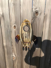 Load image into Gallery viewer, a close up of a black and gold motorcycle
