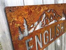 Load image into Gallery viewer, a close up of a street sign with a sky background