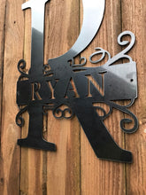 Load image into Gallery viewer, a pair of scissors on a wooden surface