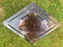 Load image into Gallery viewer, a sign that is sitting in the grass