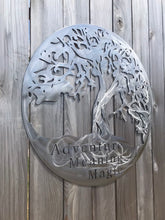 Load image into Gallery viewer, a close up of a mirror on a wall