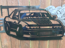 Load image into Gallery viewer, a car that is parked in a driveway