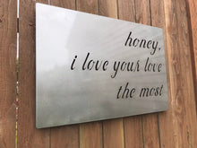 Load image into Gallery viewer, a sign that is on a wooden table