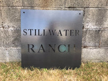 Load image into Gallery viewer, a sign on the side of a building
