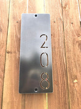 Load image into Gallery viewer, a close up of a cell phone on a wooden surface