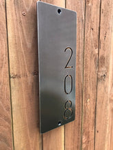 Load image into Gallery viewer, a metal refrigerator sitting on a wooden floor