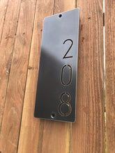 Load image into Gallery viewer, a close up of a cell phone on a wooden surface