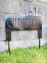 Load image into Gallery viewer, a sign that is on the side of a building