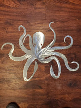 Load image into Gallery viewer, a pair of scissors sitting on top of a wooden table