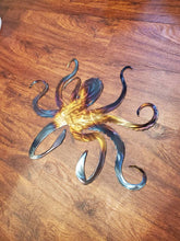 Load image into Gallery viewer, a pair of scissors sitting on top of a table