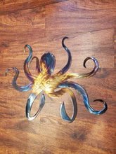 Load image into Gallery viewer, a pair of scissors sitting on top of a table