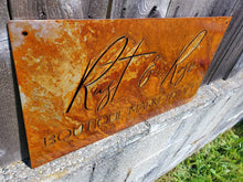 Load image into Gallery viewer, a close up of an orange toaster on the side of a road