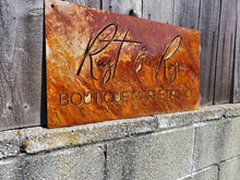 Load image into Gallery viewer, a sign that is on the side of a building