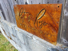 Load image into Gallery viewer, a close up of a sign on the side of a building