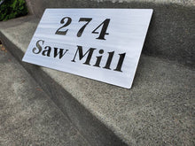 Load image into Gallery viewer, a sign that is on the side of a street