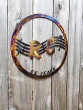 Load image into Gallery viewer, a close up of a tennis racket on a wall
