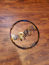 Load image into Gallery viewer, a close up of a tennis racket on a tennis court