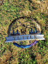 Load image into Gallery viewer, a blue and white sign sitting in the grass