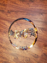Load image into Gallery viewer, a close up of a tennis racket on a court