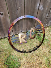 Load image into Gallery viewer, a close up of a tennis racket on the ground