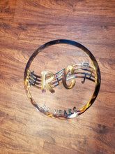 Load image into Gallery viewer, a close up of a tennis racket on a wooden surface