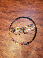 Load image into Gallery viewer, a close up of a tennis racket on a wooden surface