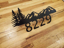 Load image into Gallery viewer, a pair of scissors sitting on top of a wooden table