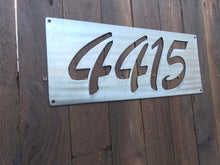 Load image into Gallery viewer, a close up of a street sign on a wooden pole 
